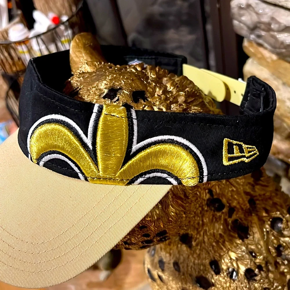 NFL Store. Saints Fleur De Lis Black and Gold. NWOT Visor. Adjustable.